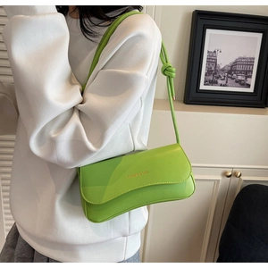 Detailed view of neon green PU leather shoulder bag with FASHION & BAGS logo
