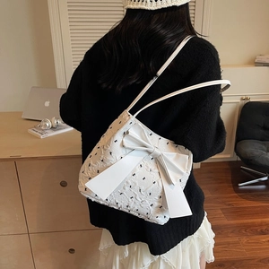 White bow underarm bag with pleated fabric and butterfly pattern for women's casual style