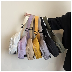 Multi-color nylon crossbody bags display featuring seven vibrant colors and wide straps