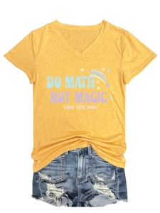 Flat lay of a yellow V-neck T-shirt with 'DO MATH' print and distressed denim shorts