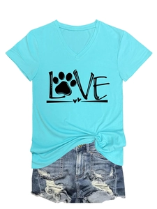 Flat lay of light blue V-neck T-shirt with paw print LOVE design and ripped denim shorts