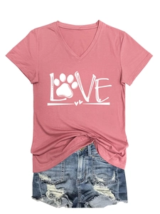 Detail of pink V-neck T-shirt with LOVE paw print design and ripped denim shorts