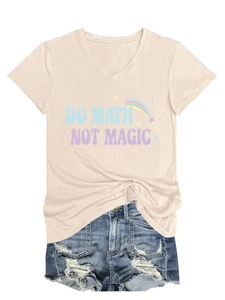 Flat lay of beige V-neck T-shirt with 'Do Math Not Magic' print and distressed denim shorts
