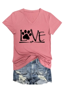 Detailed view of pink V-neck T-shirt with LOVE print and distressed denim shorts
