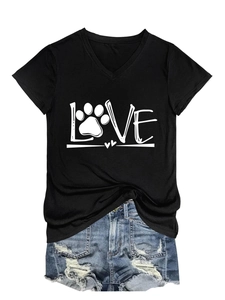 Detail of V-neck black T-shirt with LOVE paw print design and ripped denim shorts