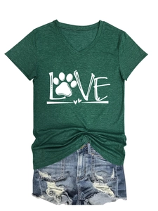 Detail of green V-neck T-shirt with LOVE paw print design and ripped denim shorts