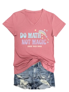 Flat lay of pink V-neck T-shirt with 'Do Math Not Magic' print and ripped denim shorts