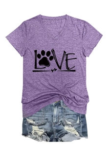 Detail of purple V-neck t-shirt with black LOVE text print and blue ripped denim shorts