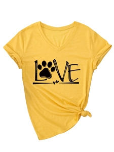Detail of yellow V-neck T-shirt featuring a LOVE graphic with a paw print and heart accent