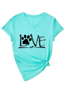 Detail of mint green V-neck T-shirt with LOVE paw print design and knotted hem detail