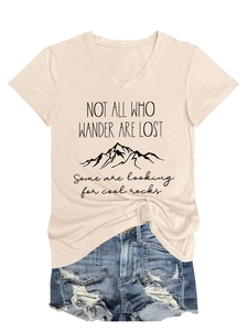 Detail of V-neck T-shirt with mountain graphic and distressed denim shorts outfit