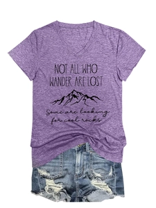 Detail of V-neck t-shirt with mountain print and ripped denim shorts with fringe