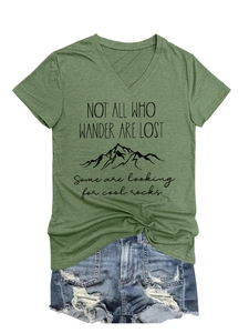Detail of dark green V-neck T-shirt with mountain print and frayed denim shorts