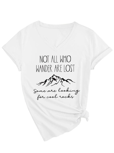 Detailed view of white V-neck T-shirt with knot hem and mountain graphic text