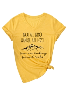 Detail of V-neck yellow cotton T-shirt with mountain print and tied hem fashion accent