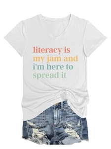 Flat lay of white V-neck T-shirt with literacy quote and distressed denim shorts
