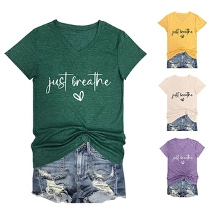 Detail view of V-neck tee featuring Just Breathe script and heart print in multiple colors