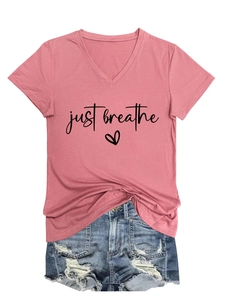 Detail of V-neck cotton T-shirt with just breathe print and denim shorts combo