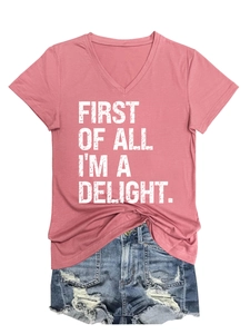 V-neck pink T-shirt with 'First of all I'm a delight' slogan and distressed denim shorts