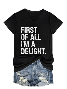 Detail of V-neck black T-shirt with First Of All I'm A Delight print and ripped denim shorts