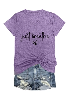 Detail view of the 'just breathe' heart print on a purple V-neck short sleeve casual T-shirt