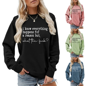Detail of colorful crewneck sweatshirts showing the printed quote on cotton fabric