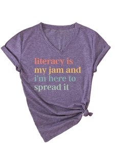 Detail of purple V-neck T-shirt with knotted hem and Literacy Is My Jam colorful print