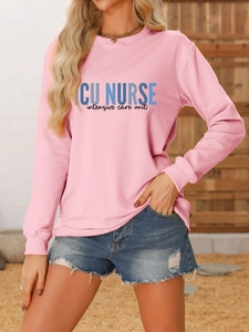 Close-up of ICU NURSE letter print on light pink crewneck sweatshirt for women