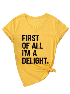 Detail of V-neck yellow t-shirt with knotted hem and First Of All I'm A Delight text