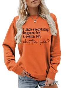 Detail of orange crewneck sweatshirt showing the black text slogan print in center