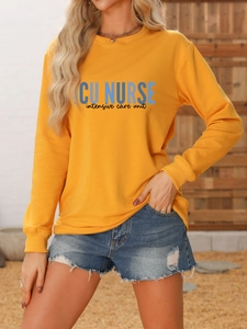 Detail of ginger yellow ICU NURSE sweatshirt showing ribbed cuffs and printed lettering