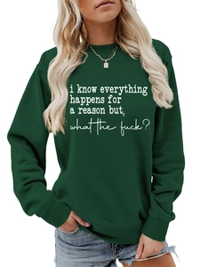 Close-up of white slogan print on forest green crewneck sweatshirt fabric and neckline
