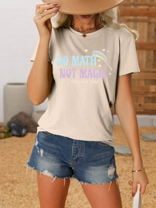 Detail of Do Math Not Magic slogan print on a beige cotton t-shirt with denim shorts