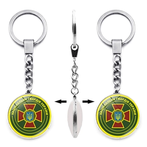 Detailed view of Ukraine National Guard silver metal keychain with double-sided emblem