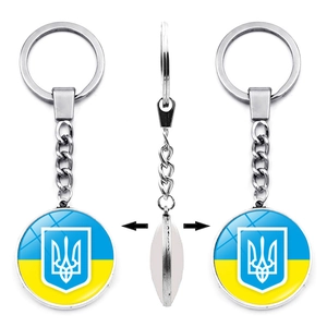 Rotating double-sided keychain featuring the Ukraine coat of arms on a blue and yellow flag