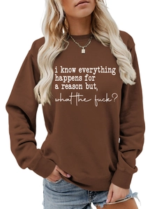 Close-up of deep brown sweatshirt featuring white slogan print and ribbed crew neck finish