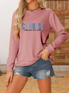 Detail view of ICU Nurse crewneck sweatshirt in dusty rose pink with ribbed cuffs