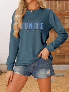 Detail of dark teal ICU NURSE crewneck sweatshirt with high-quality screen printed text
