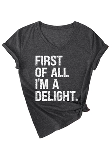 Detailed view of dark grey V-neck t-shirt with First of all I'm a delight slogan