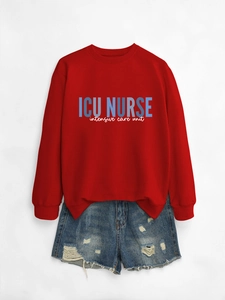 Flat lay of red ICU NURSE sweatshirt with blue distressed denim shorts on white background