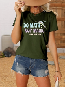 Detail of dark green cotton T-shirt featuring artistic text with vintage denim shorts