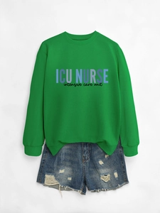 Detail of green ICU Nurse sweatshirt paired with distressed blue denim shorts