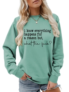 Detail of the quote print on a mint green loose fit crewneck cotton sweatshirt