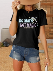 Outdoor shot of a black T-shirt with DO MATH NOT MAGIC artistic text and denim shorts