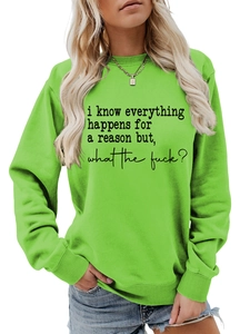 Close-up of bright green sweatshirt fabric with black slogan print and ribbed collar