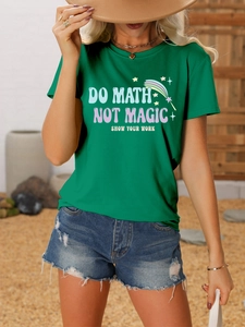 Detail of green T-shirt with 'DO MATH NOT MAGIC' print and distressed denim shorts