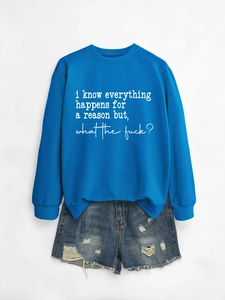 Royal blue sweatshirt with white text paired with distressed denim shorts on grey background