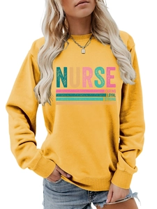 Detail of nurse theme graphic print on mustard yellow long sleeve casual sweatshirt
