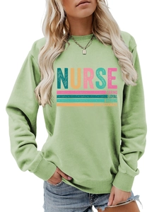 Detail of the high-quality cotton fabric and colorful NURSE slogan on green sweatshirt