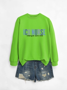 Neon green ICU NURSE crewneck sweatshirt paired with ripped denim shorts on white background